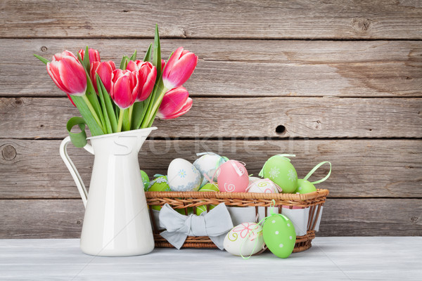 Stock photo: Easter eggs and red tulips