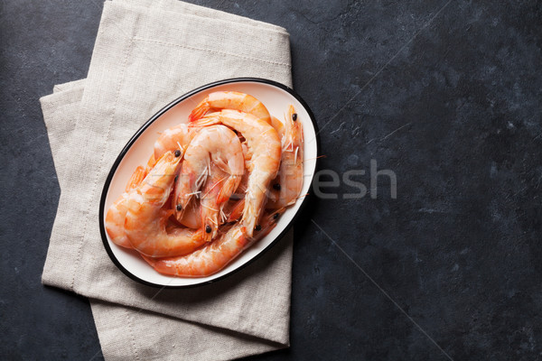 Fresh seafood on stone table. Shrimps Stock photo © karandaev