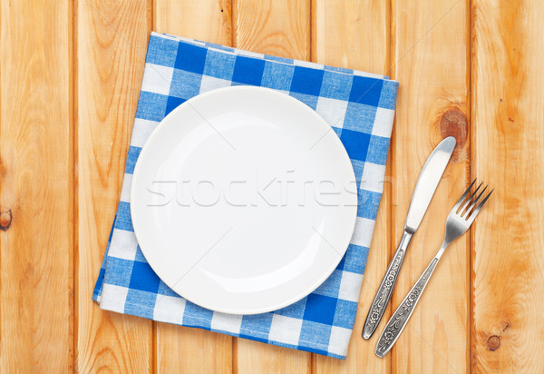 üres tányér ezüst étkészlet törölköző fa asztal felülnézet Stock fotó © karandaev
