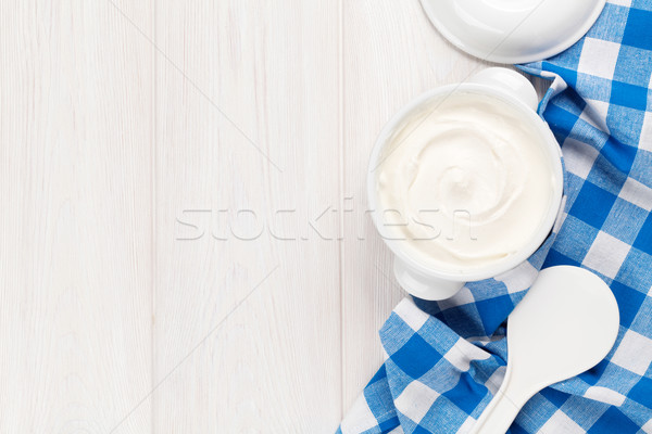 Crema agria tazón mesa de madera superior vista espacio de la copia Foto stock © karandaev