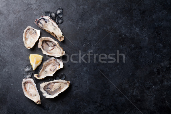 Oysters and lemon Stock photo © karandaev