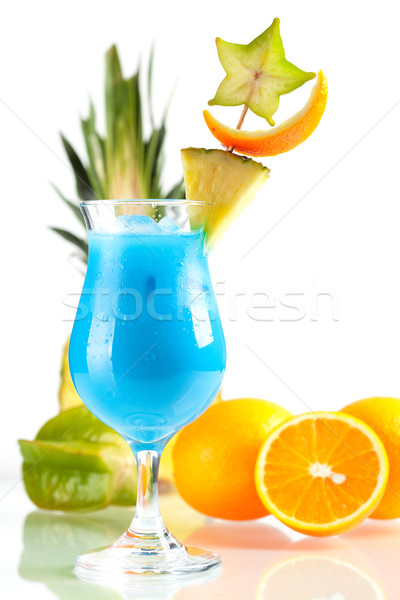 Blue Hawaii tropical cocktail with pineapple on background Stock photo © karandaev