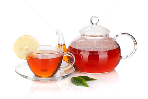 Glass teapot and cup of black tea with lemon slice Stock photo © karandaev