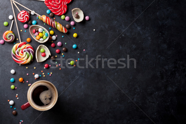 Colorful candies and coffee cup Stock photo © karandaev