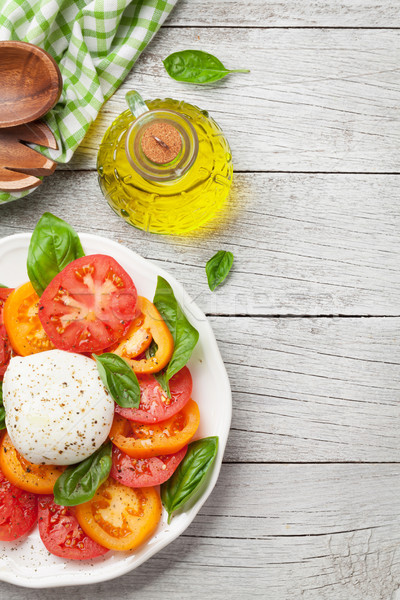 Caprese salade tomaten basilicum mozzarella top Stockfoto © karandaev