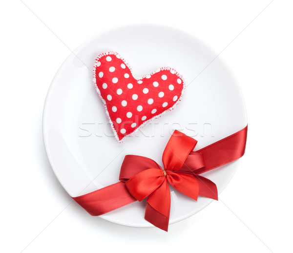 Valentine's Day heart shaped toy over plate with red bow Stock photo © karandaev