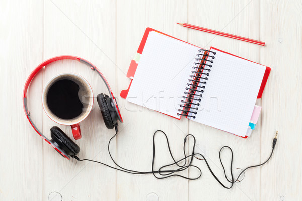Headphones, coffee cup and notepad on desk Stock photo © karandaev