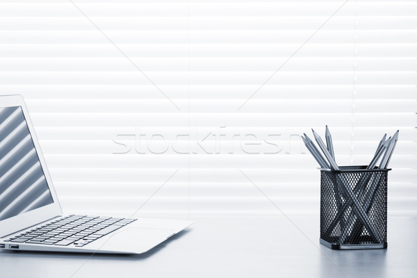 Office workplace with laptop and pencils Stock photo © karandaev