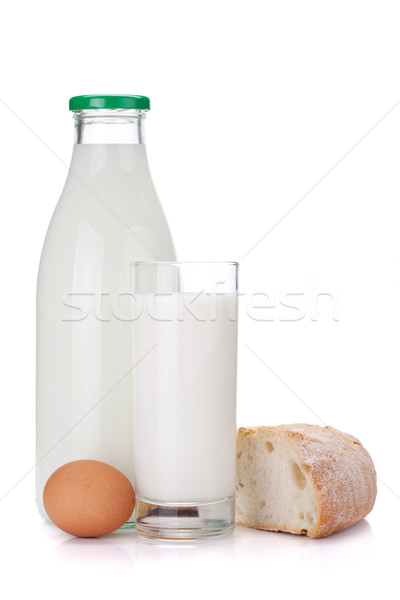 Milk bottle, glass, eggs and bread Stock photo © karandaev