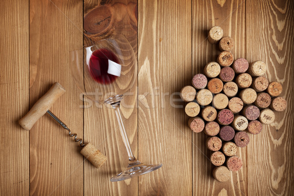 Stock photo: Red wine glass, corkscrew and grape shaped corks