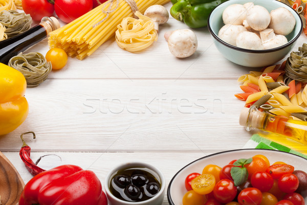 Stock photo: Italian food cooking ingredients. Pasta, vegetables, spices