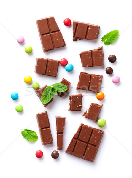 Broken chocolate bar and candies Stock photo © karandaev