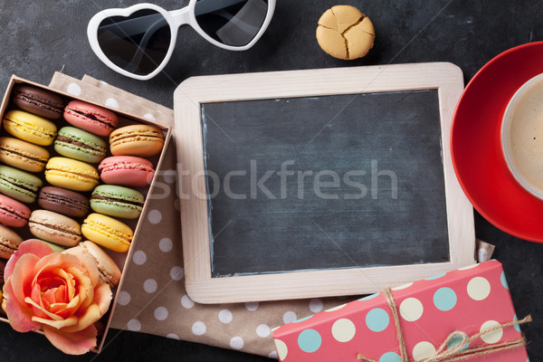 Colorful macaroons, coffee and blackboard Stock photo © karandaev