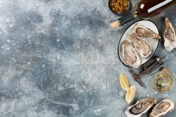 Fresh oysters and white wine Stock photo © karandaev