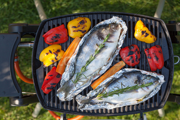 Stock photo: Fresh dorado fish and bell pepper grill cooking