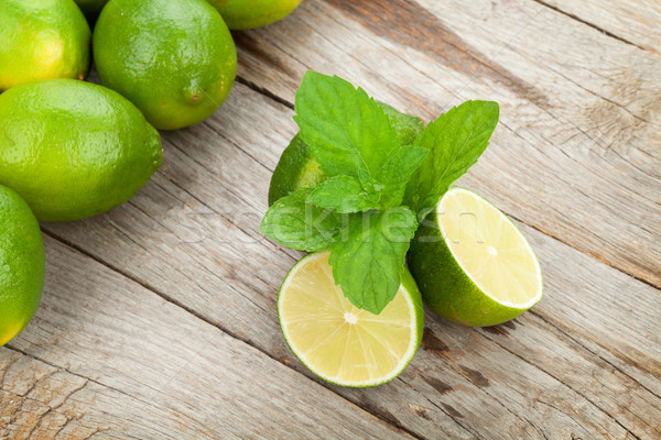 Fresh ripe limes with mint Stock photo © karandaev