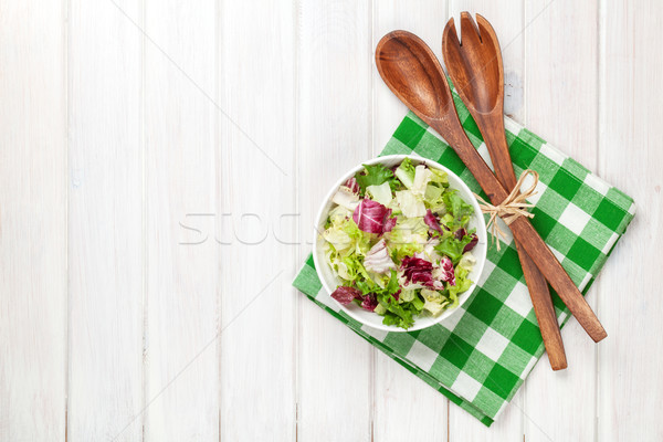 Fresh healthy salad and kitchen utensils Stock photo © karandaev