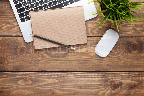 Stock photo: Office desk table with computer, supplies and flower