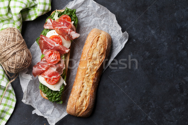 Ciabatta sandwich with salad, prosciutto and mozzarella Stock photo © karandaev