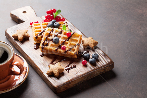 Coffee, sweets and waffles with berries Stock photo © karandaev