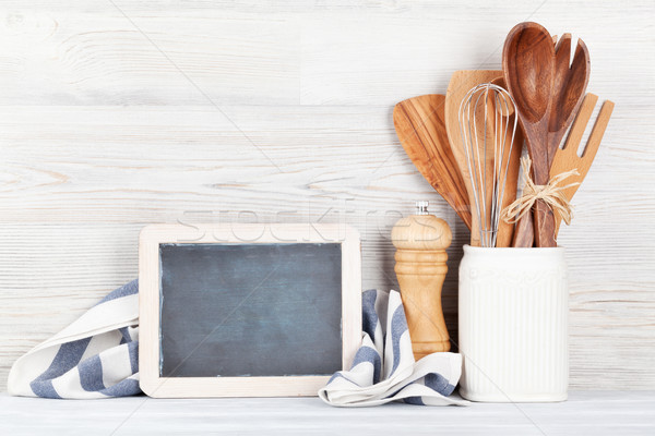 Kitchen utensils and chalkboard Stock photo © karandaev