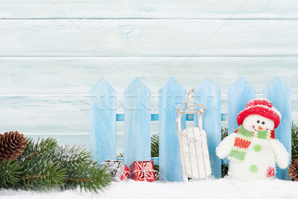 Christmas gift boxes, snowman toy and fir tree branch Stock photo © karandaev