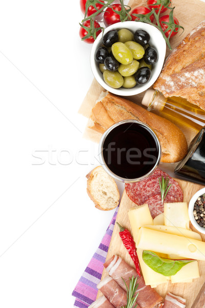 Stock photo: Red wine with cheese, prosciutto, bread, vegetables and spices