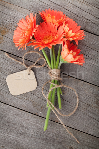 Bunch of gerbera flowers with tag Stock photo © karandaev