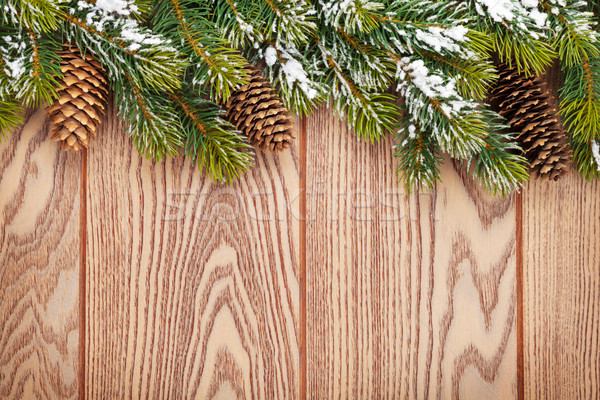 Christmas wooden background with snow fir tree Stock photo © karandaev