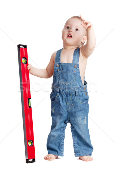 Small baby worker with level Stock photo © karandaev