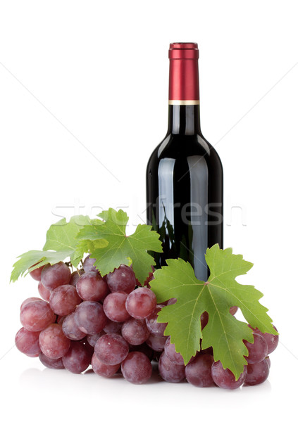 Red wine bottle and grapes Stock photo © karandaev