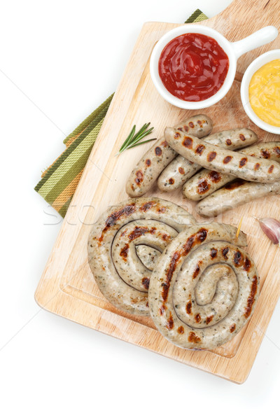 Grilled sausages with ketchup and mustard Stock photo © karandaev