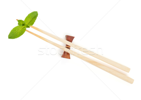 Sushi eetstokjes mint bladeren geïsoleerd witte Stockfoto © karandaev