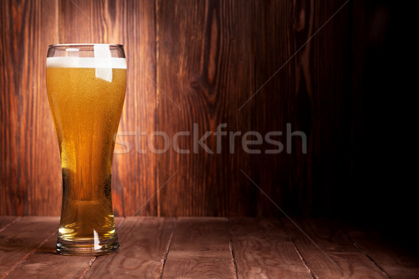 Lager beer glass on wooden table Stock photo © karandaev