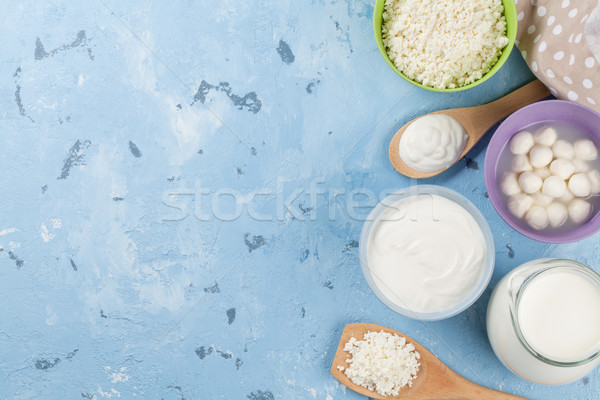 Tejtermékek kő asztal tejföl tej sajt Stock fotó © karandaev