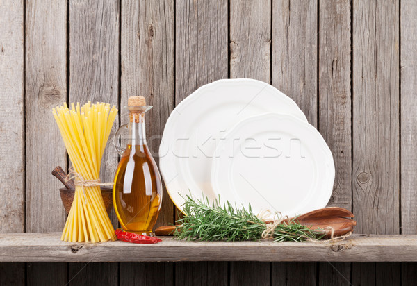 Stock photo: Kitchen utensils, herbs and spices on shelf