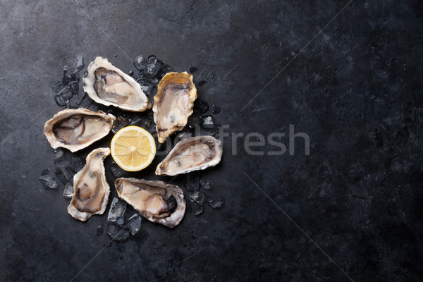 Oysters and lemon Stock photo © karandaev