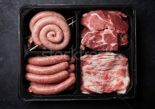 Raw meat and sausages Stock photo © karandaev