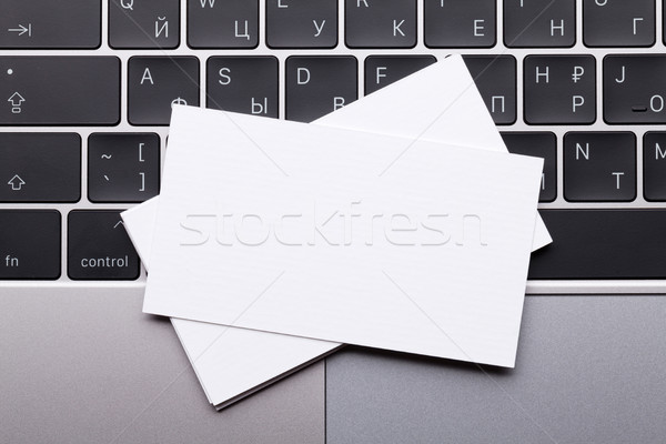 Blank business cards over laptop keyboard Stock photo © karandaev