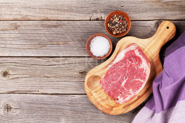 Raw beef steak with spices and herbs Stock photo © karandaev