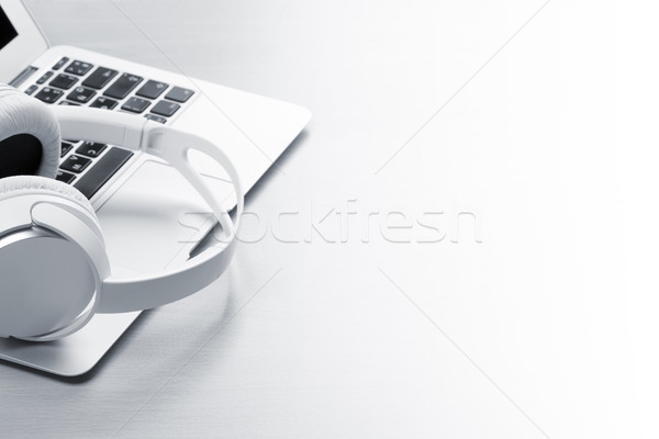 Headphones over laptop Stock photo © karandaev