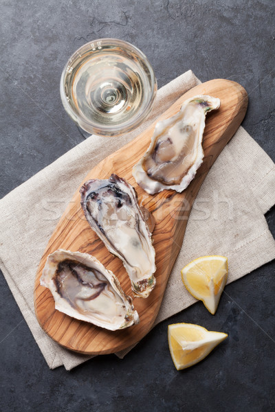 Oysters and wine Stock photo © karandaev