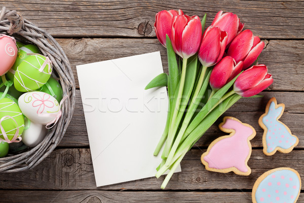 Red tulip flowers and Easter cookies and eggs Stock photo © karandaev