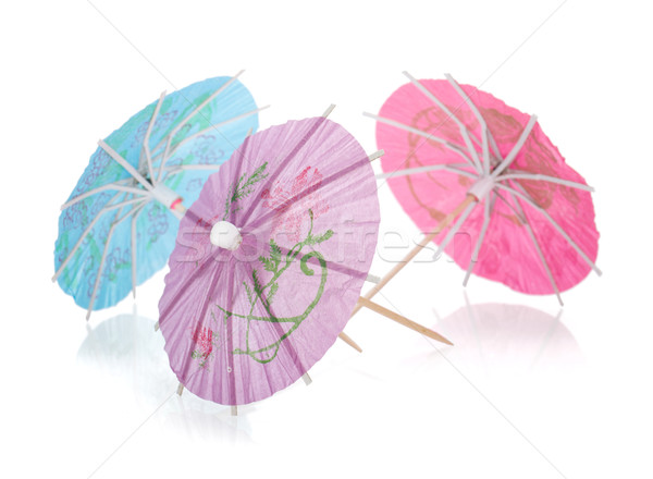 Three colored cocktail umbrellas Stock photo © karandaev