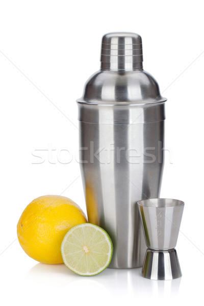 Cocktail shaker with measuring cup and citruses Stock photo © karandaev