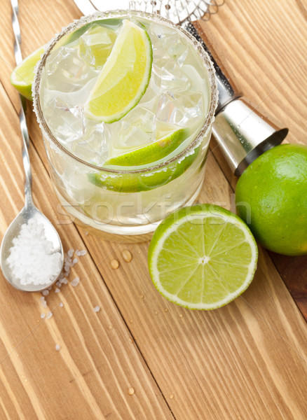 Classic margarita cocktail with salty rim on wooden table Stock photo © karandaev