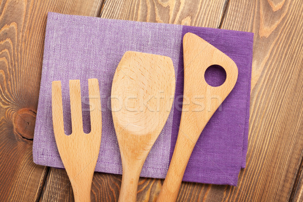Wood kitchen utensils over wooden table Stock photo © karandaev