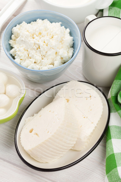 Tejtermékek tejföl tej sajt fa asztal felső Stock fotó © karandaev