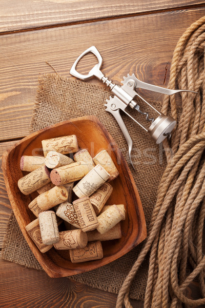 Bowl with wine corks and corkscrew Stock photo © karandaev