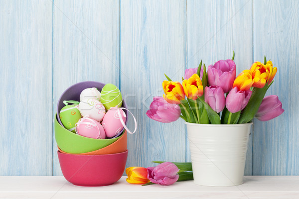 Colorful easter eggs and tulips Stock photo © karandaev